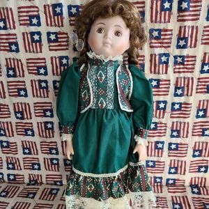 porcelain ornamental doll. no markings.